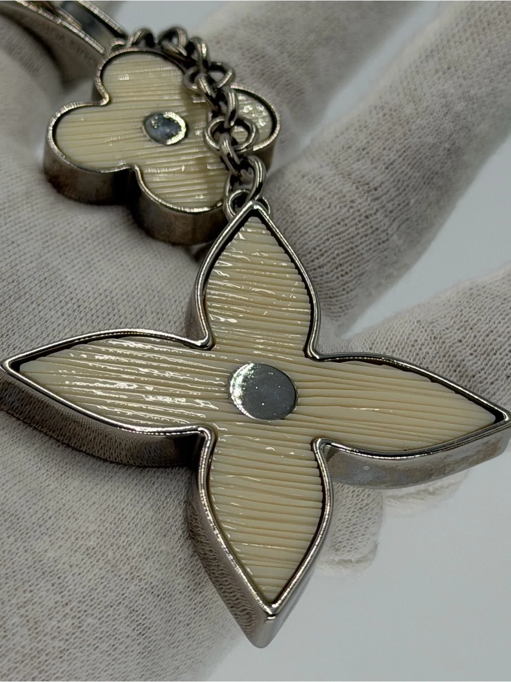 Authentic Louis Vuitton Fleur d’Epi Silver & Cream Bag Charm w/Dust Bag and COA